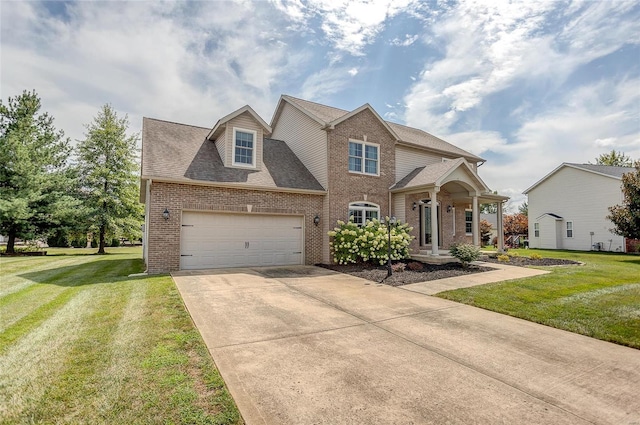 view of front of house featuring a front lawn and a garage