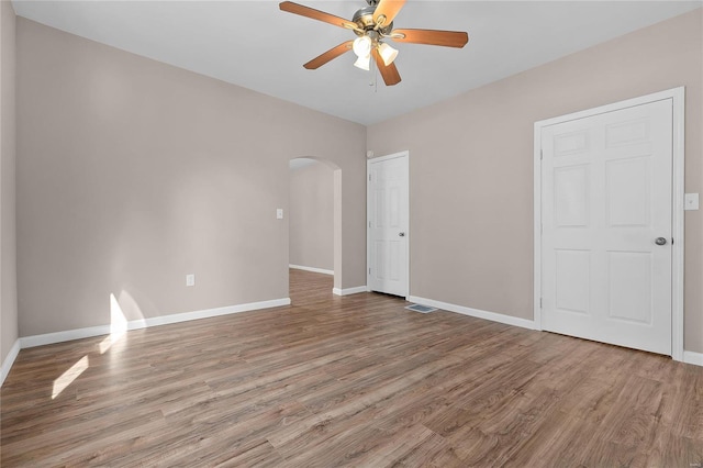 interior space featuring wood-type flooring and ceiling fan