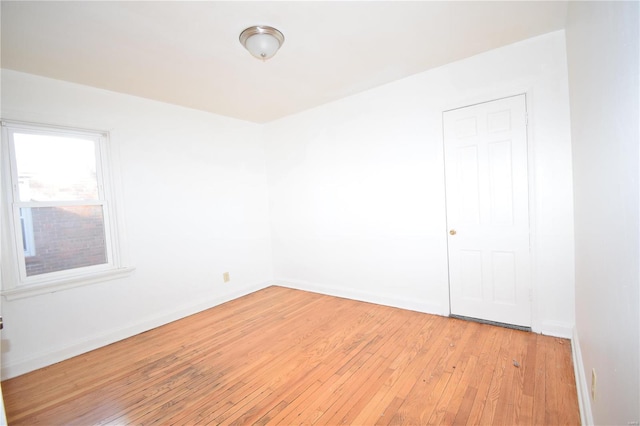 spare room featuring light wood-type flooring