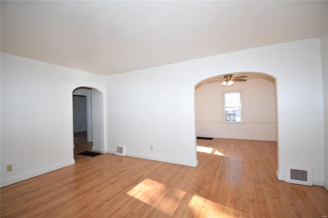 unfurnished room with light wood-type flooring and ceiling fan