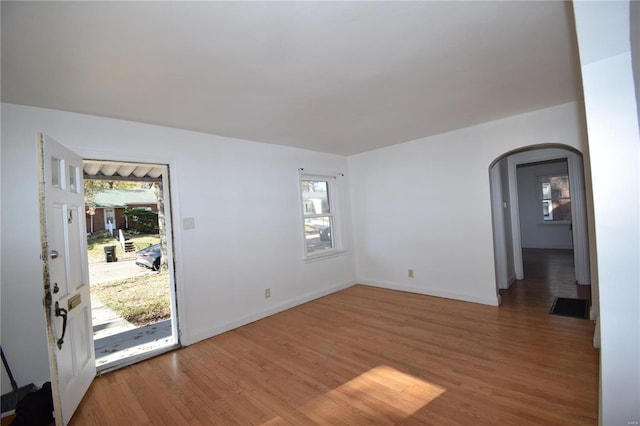 empty room with hardwood / wood-style flooring