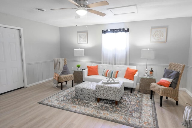 sitting room featuring light wood-type flooring and ceiling fan