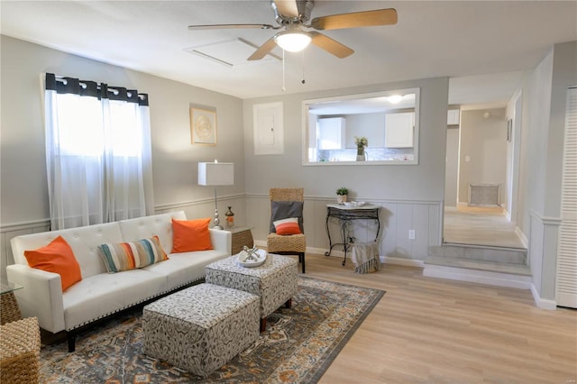 living room featuring ceiling fan and light wood-type flooring