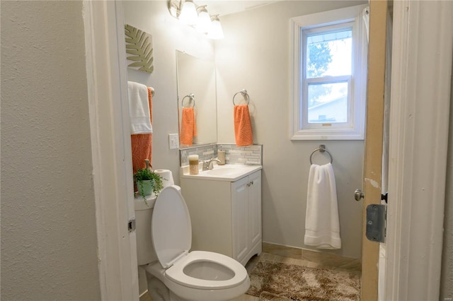 bathroom with tile patterned floors, vanity, and toilet