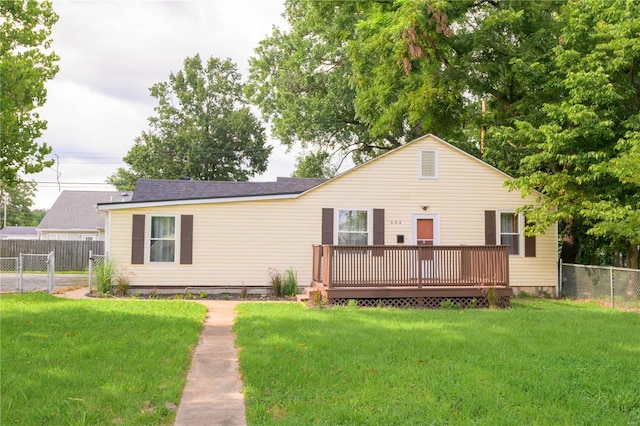 view of front of house with a deck and a front lawn