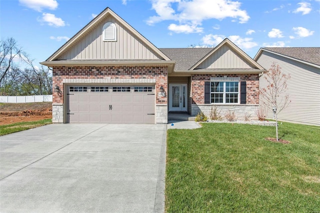 view of front of home featuring a garage and a front lawn