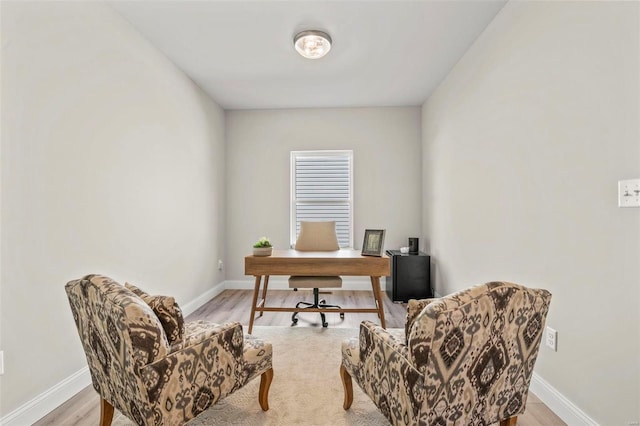 office space with light wood-type flooring