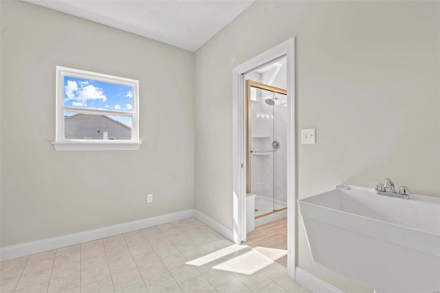 bathroom with tile patterned flooring and a shower with shower door