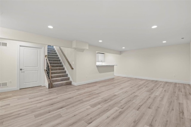 basement featuring light hardwood / wood-style floors