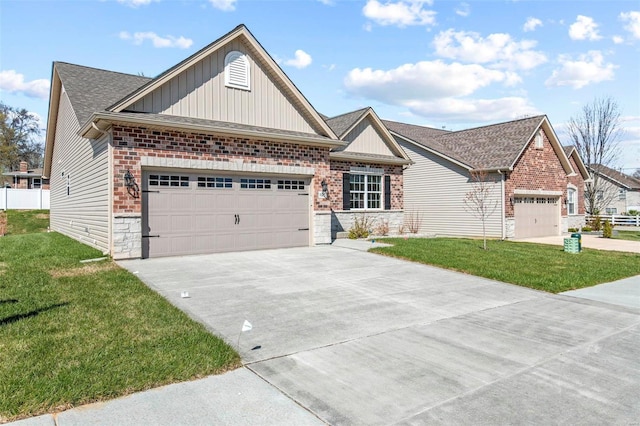 craftsman inspired home featuring a garage and a front lawn