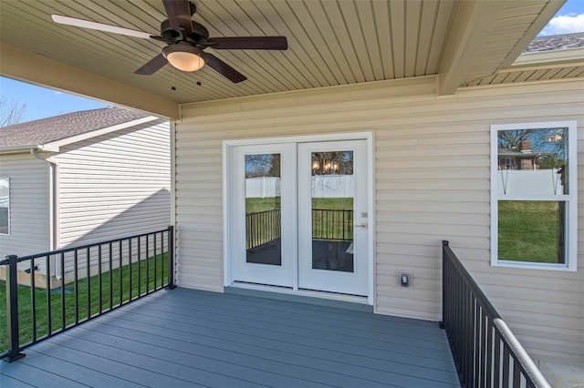 wooden terrace with ceiling fan and french doors