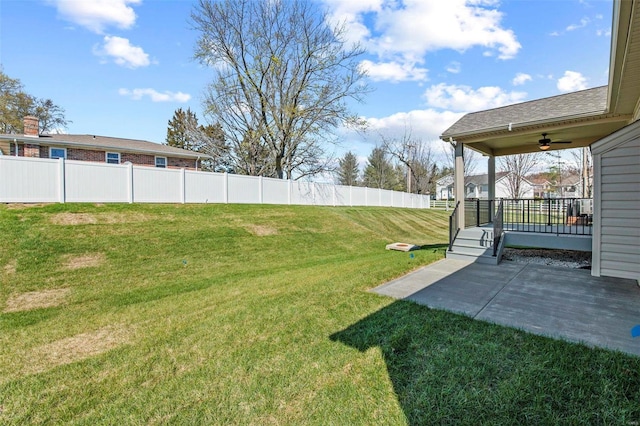 view of yard featuring ceiling fan and a patio area