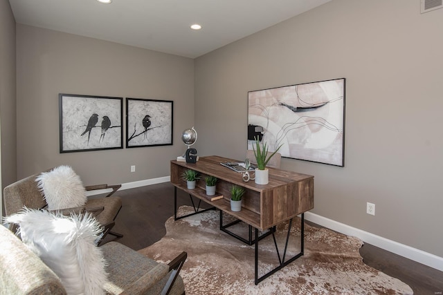 office with dark hardwood / wood-style flooring