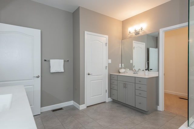 bathroom featuring vanity and tile patterned flooring