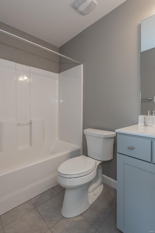 full bathroom featuring vanity, washtub / shower combination, toilet, and tile patterned flooring