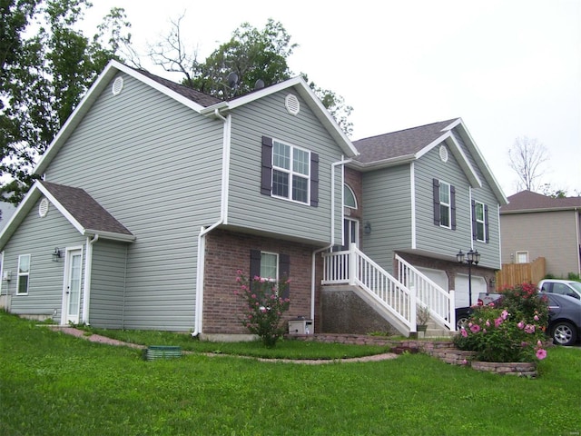 exterior space with a garage and a lawn