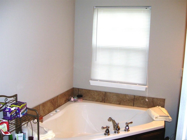 bathroom featuring a tub to relax in