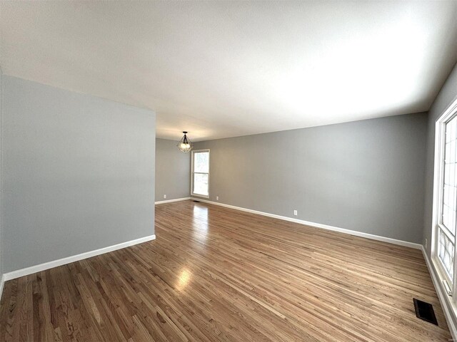 empty room featuring hardwood / wood-style floors