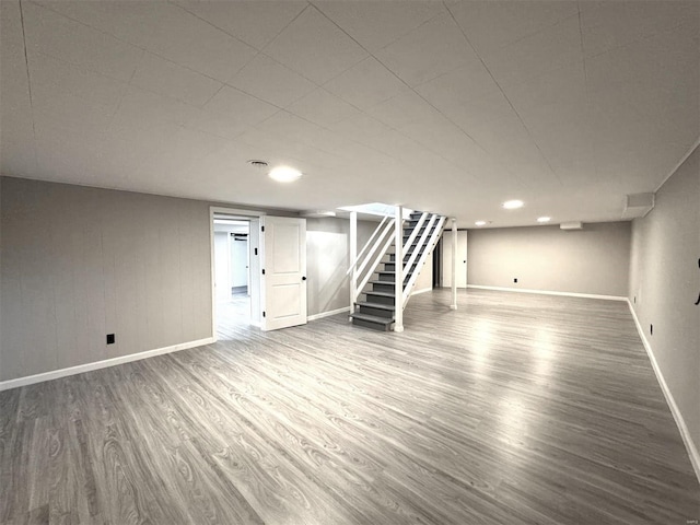 basement with hardwood / wood-style floors