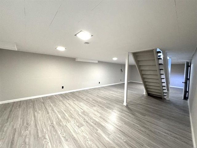 basement featuring hardwood / wood-style flooring