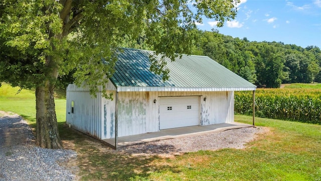 garage with a yard