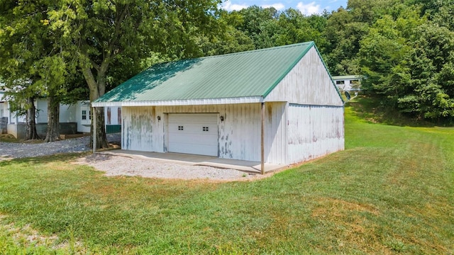 garage featuring a yard