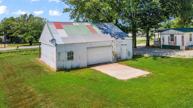 garage with a yard