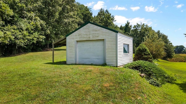 garage featuring a yard