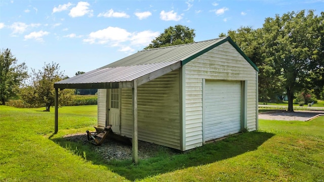 view of outdoor structure featuring a lawn