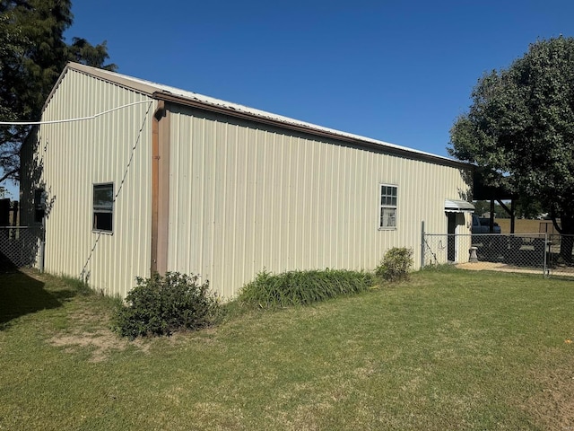 view of side of property with a lawn