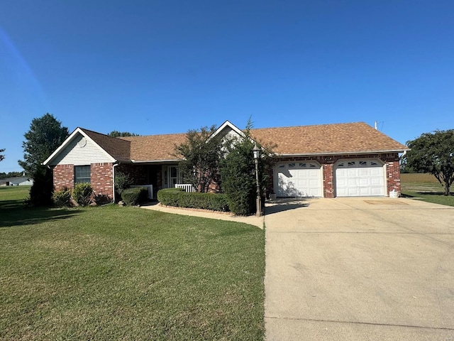 ranch-style house featuring a garage and a front lawn