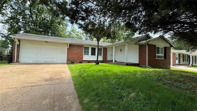 single story home with a garage and a front lawn