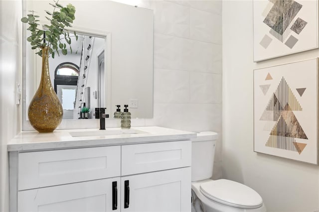 bathroom with toilet and vanity