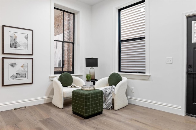 living area featuring light hardwood / wood-style floors