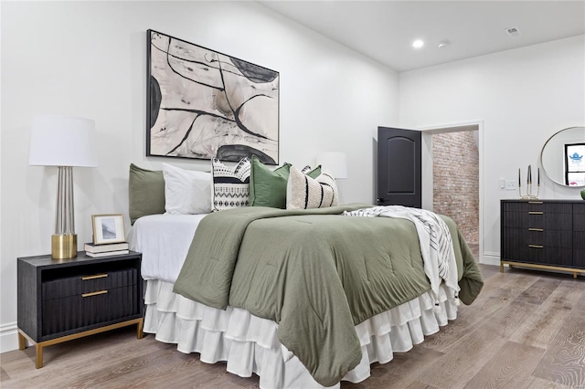 bedroom featuring wood-type flooring