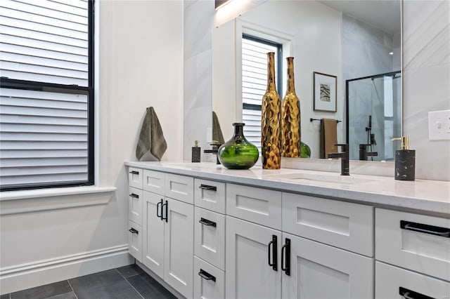 bathroom with vanity, tile patterned floors, and walk in shower