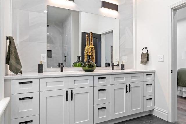 bathroom with vanity, a shower, and hardwood / wood-style flooring