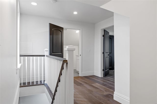 corridor featuring dark hardwood / wood-style flooring