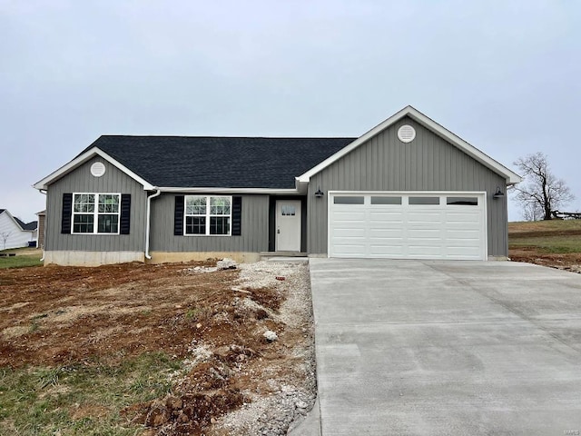 ranch-style house featuring a garage