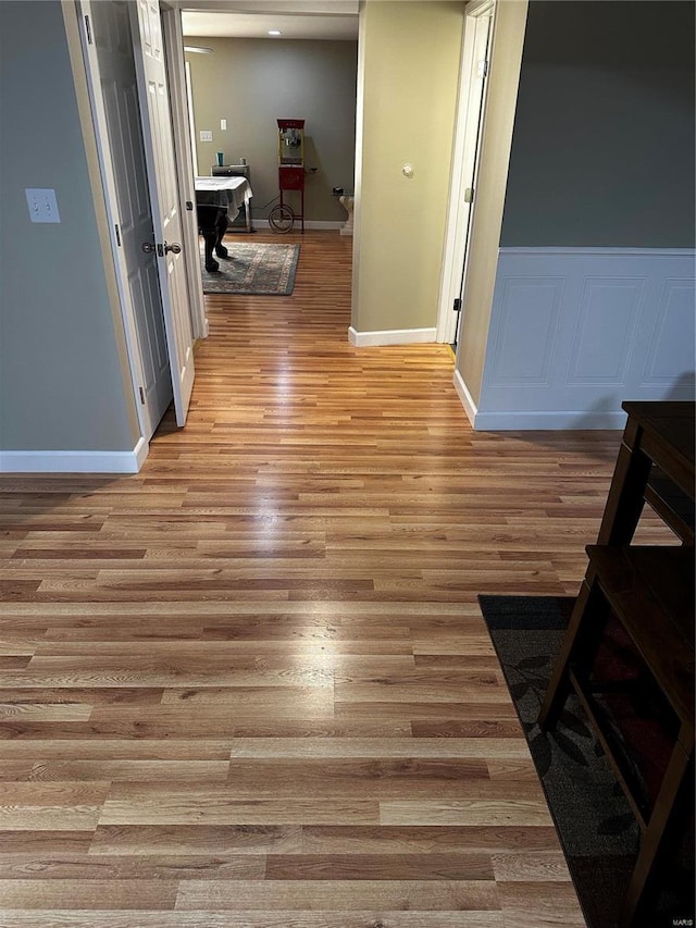 hall with light hardwood / wood-style floors