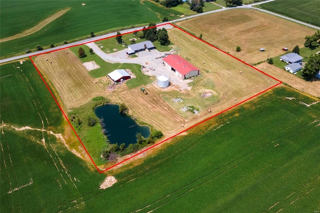 drone / aerial view with a water view and a rural view