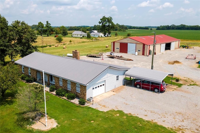 birds eye view of property with a rural view