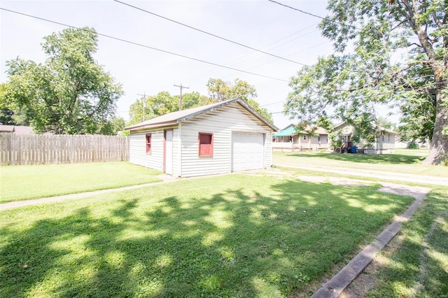 view of yard with an outdoor structure and a garage