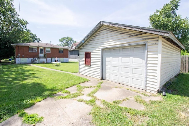 garage with a yard