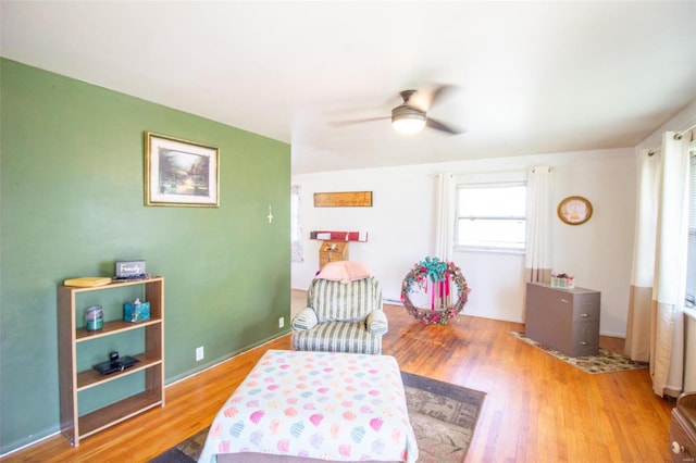 bedroom with ceiling fan and light hardwood / wood-style flooring