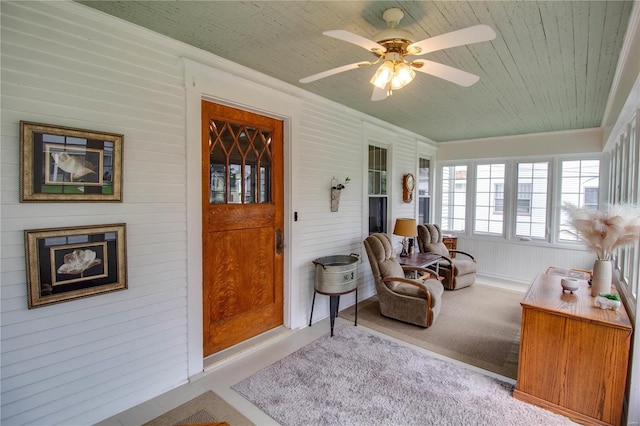 sunroom featuring ceiling fan