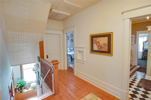 hallway with hardwood / wood-style flooring