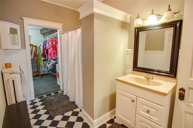 bathroom featuring vanity and crown molding