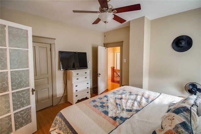 bedroom featuring wood-type flooring and ceiling fan