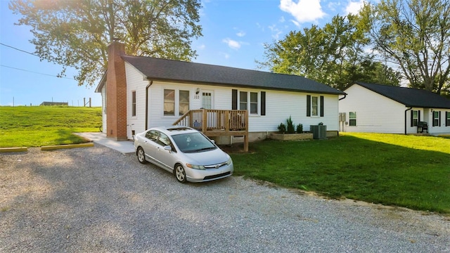 ranch-style home with a front lawn